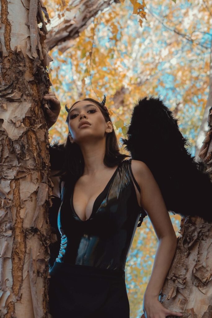A woman is dressed up as the female Halloween character Dark Angel
