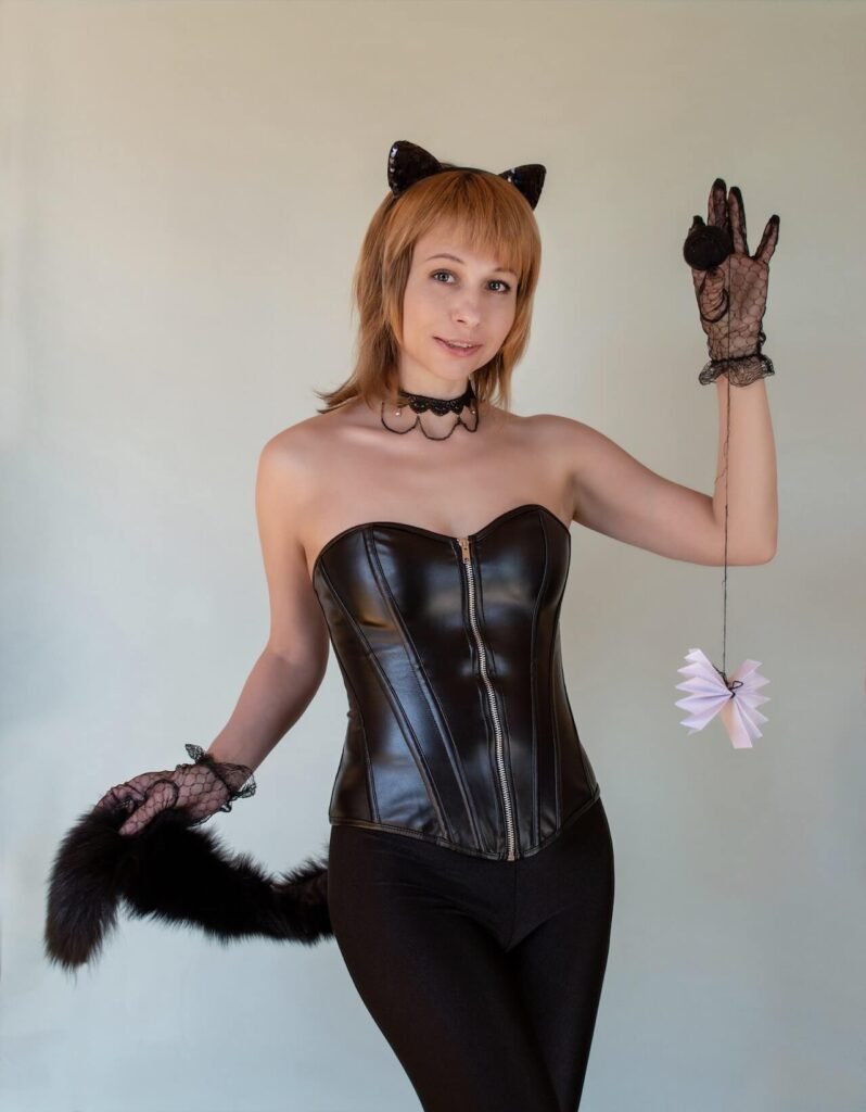 A woman is dressed up in a sexy cat Halloween costume