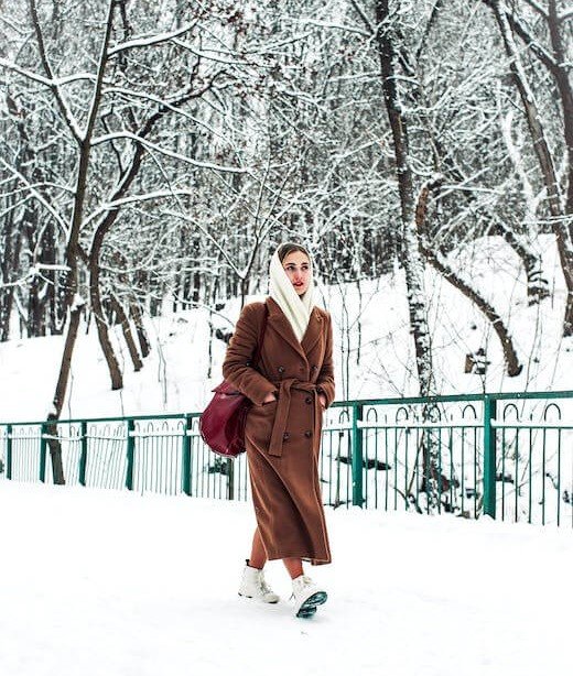 A woman is wrapped up against the cold weather