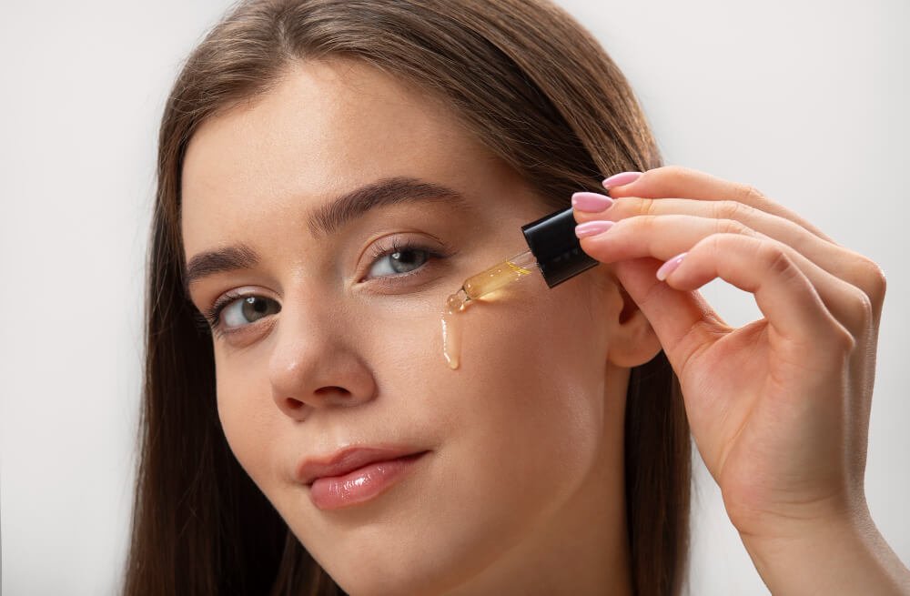 A woman applies skincare products