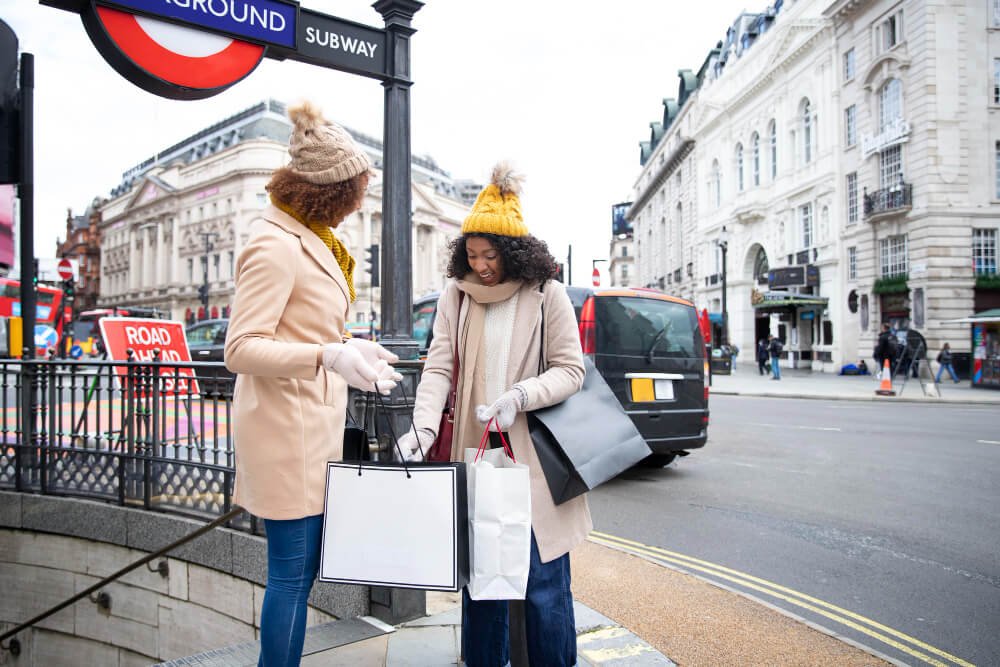 Two women with shopping bags in London