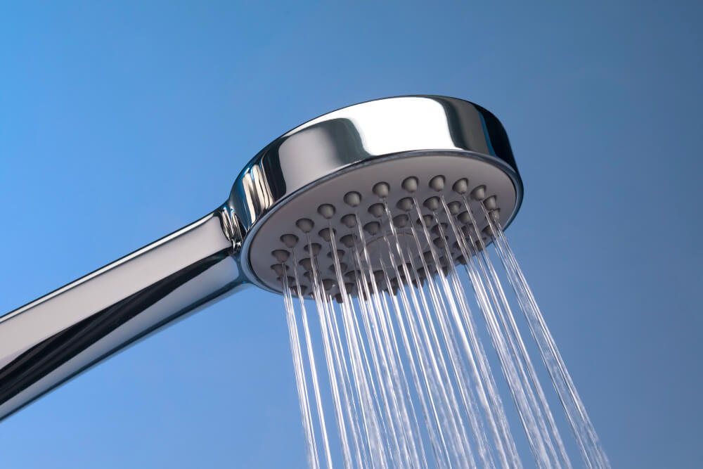 Water flows out of a shower head
