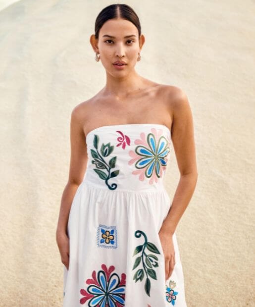 A woman wears a Boho Festival Max Dress