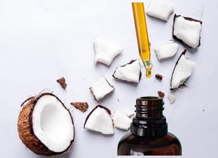 Coconut oil and a bottle of argan oil