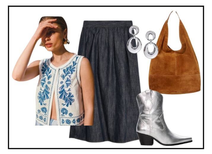 Boho festival outfit, white and blue embroidered waistcoat, black maxi skirt, brown suede hobo bag, silver hoop earrings, and silver cowboy boots.