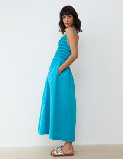A model wears a cobalt blue midi sundress
