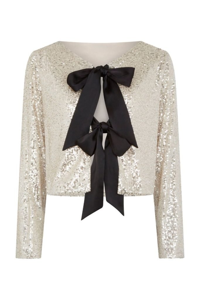 Christmas party outfits: Sequin cardigan with bow fastenings