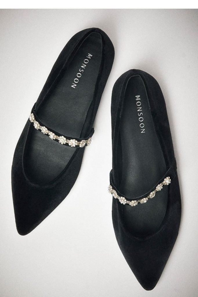Christmas party outfits: A pair of black ballet flats with diamante strap