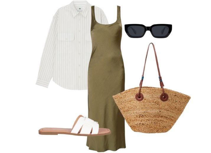 How to style a slip dress for a daytime holiday look with an olive green maxi slip dress, a white striped shirt, a basket tote bag, and white flat sandals