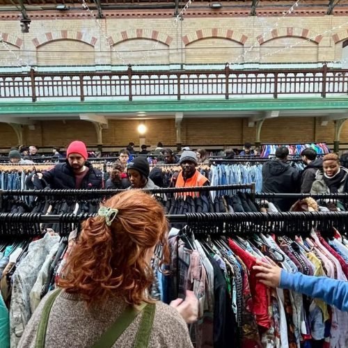 A woman browsing at a vintage fair.