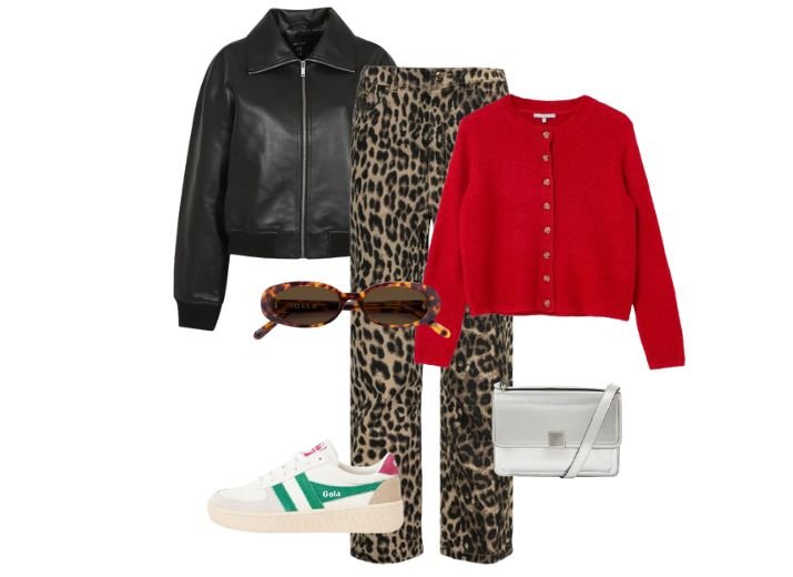 A leopard print modest outfit. leopard print jeans, red knitted crew neck cardigan, a black leather bomber jacket, a silver cross body bag, a pair of white and green Gola trainers and a pair of tortoise shell sunglasses.