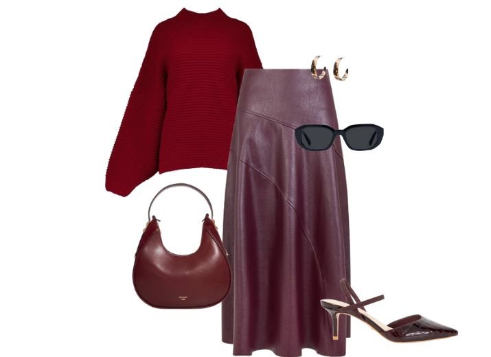 An all burgundy modest outfit, a long leather burgundy skirt, a red knitted roll-neck jumper, a pair of burgundy croc court shoes, a dark red shoulder bag, with a pair of black sunglasses and a tortoise shell hoop earrings.