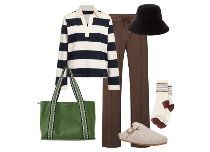 A comfy and casual modest outfit, dark brown tailored jogger trousers, a stripy rugby top, a black bucket hat, a pair of suede mules, and a large green leather tote bag.