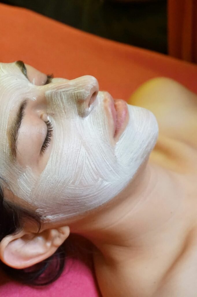 What is an express facial?
A woman is having a facial mask applied to her skin. 