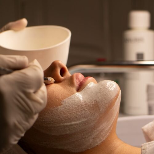 A woman is having a facial treatment