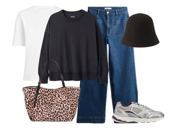 How to style wide leg jeans in Winter.
Outfit: Blue wide leg jeans, a black knit jumper, a white t-shirt, a black bucket hat, a leopard print tote bag, and silver and white runner style trainers.