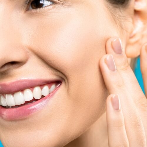 A close up of a woan with healthy and glowing skin